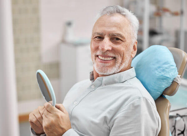 Man getting Emergency denture Repair Brisbane at Alphagarde Mobile Denture Clinic