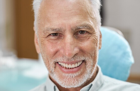 Man with Full dentures Brisbane at Alphagarde mobile denture clinic